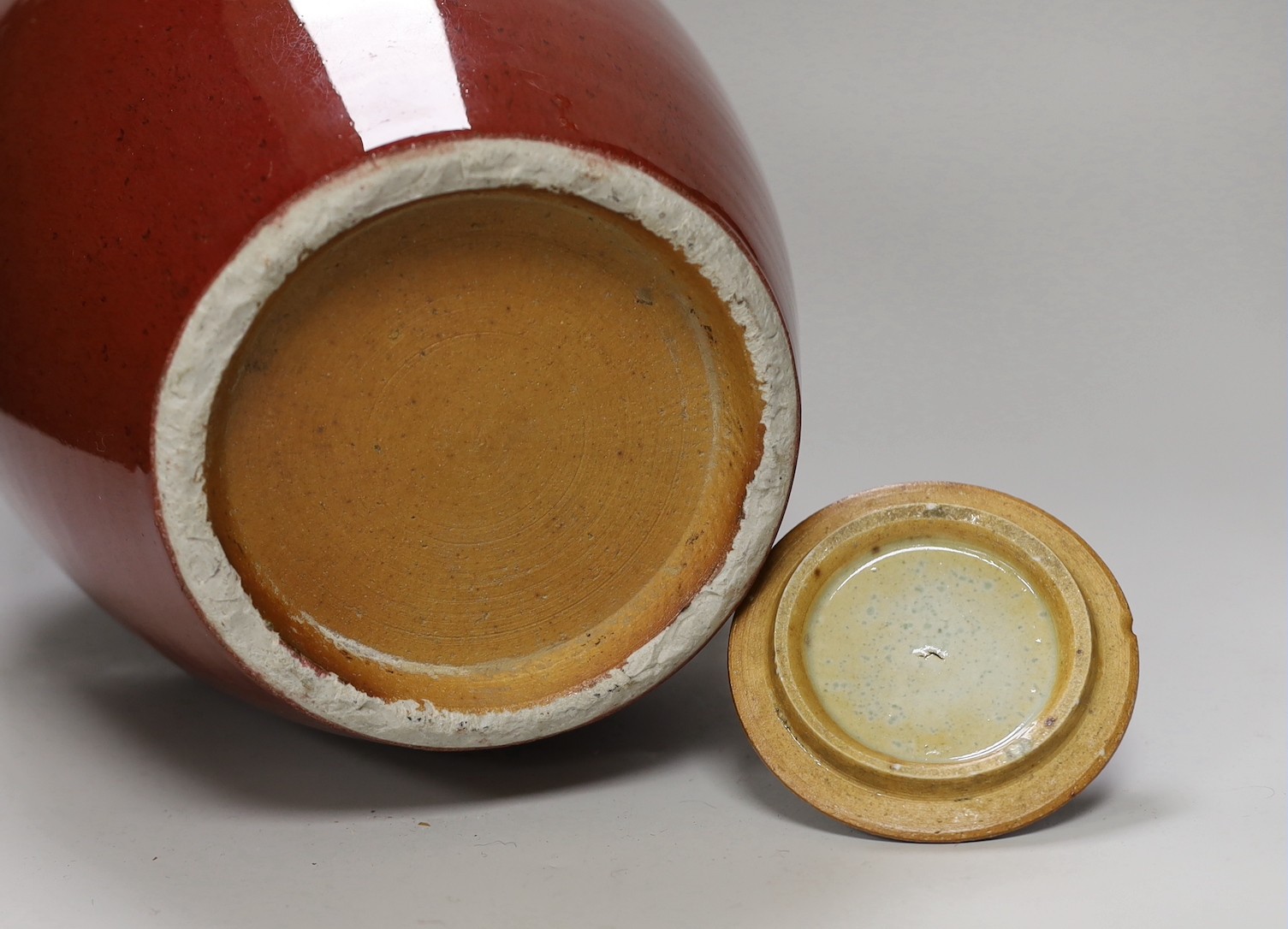 An early 20th century Chinese sang de boeuf jar and cover on hardwood stand, 36cm total